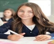 65507484 portrait of brunette school girl sitting in classroom and looking at camera.jpg from brunette school