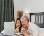 asian senior couple using laptop at home asian senior chinese grandparents husband and wife happy after wake up watching movie lying on bed in bedroom at home in the morning concept photo.jpg from chinese wife while husband films chinese porn