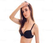 portrait of a beautiful young girl with beautiful natural breasts in a black bra which has raised her hand to head and looks into the camera photo.jpg from young bra tits