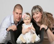 family portrait of mom dad and one year old daughter parents and little child happy family with a small child photo.jpg from small old mom