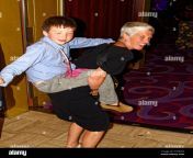 woman carrying boy on back sleepy child family aunt cruise ship vacation travel fun happy people mr 2cg92k2.jpg from aunty carrying