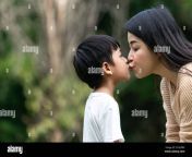 portrait beautiful asian mom and her cute son kissing with love while looking at each other cute and warm 2cgeerx.jpg from japan mom and sons firn the sex