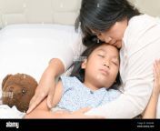 asian cute daughter hugging mother before sleep on bed love and happy concept 2a0xn8r.jpg from asian mom sleeping reap