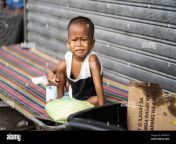 a young filipino child sitting on a metal fold up bed within a poor community cebu cityphilippines 2a9tncg.jpg from my toddler at home filipina sa amerika