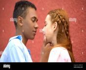 mixed race boyfriend tenderly holding girlfriends chin moment of first kiss 2anm120.jpg from chin bf