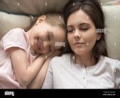 young mom sleeping relaxing in bed with cute little daughter 2aakk35.jpg from sleep mom fuk sanxxx video