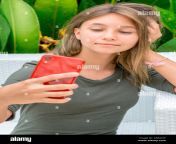 young teenage girl taking a selfie with her smartphone 2ab4cxf.jpg from young selfie twens