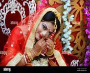 stunning a beautiful indian bride with gold jewelry very happy to her wedding ceremony in marriage house at kolkata west bengal 2c5t12w.jpg from kalkata married jpg