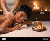 happy black woman getting healing body massage at spa 2c13hbn.jpg from ebony chubby massage