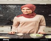 charming islam woman in hijab makes salad cooking homemade meal for family closeup 2bh8170.jpg from hijab homamade