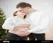 caucasian man touching his pregnant wifes belly at home husband gently kisses his pregnant wife 2gp2hf1.jpg from hubby licks and kisses his pregnant wife’s boobs