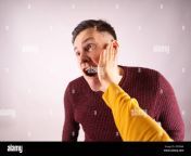 crop person slapping scared man in face emotional male getting slapped in face while shouting with closed eyes in fear on white background 2efpbar.jpg from crying and getting slapped