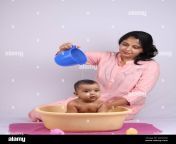 cheerful indian mother giving bath to baby 2d516pg.jpg from indian real mom son bath sexdamil