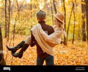 rear view on kind man holding girlfriend in hands in forest at sunny autumn day love story 2db4jw5.jpg from girlfriend forest