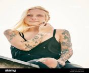 blond woman with tattoo sitting on rooftop 2f55nyx.jpg from 29 hot tattooed blonde coconut kitty tight top hard nips 720x866 jpg