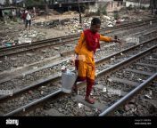 akhi 12 carries drinkable water to her fathers tea stall next to a railway track in dhaka bangladesh on friday mar 20 2020 photo by syed mahamudur rahmannurphoto 2kbk9em.jpg from akhi 12