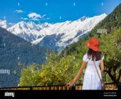 female tourist enjoying the scenic landscape view and snow peaks of the kailash himalaya range from a hotel balcony at kalpa himachal pradesh india 2h8mkec.jpg from himchal local sexy movi