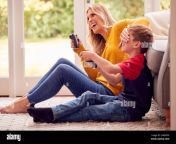 mother and son at home playing video game together with woman cheating to win 2hr0dp6.jpg from mom son cheating