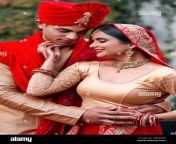 theres nothing more beautiful than a traditional wedding cropped shot of a young hindu couple on their wedding day 2j3ed5m.jpg from indian hindu beautifully new married