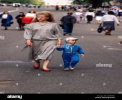 a mother and her son walking in a prdestrian street near the trinity lavra of st sergius the most important russian monastery of the russian orthodox church in sergiyev posad 70 km from moscow 2j45t32.jpg from rasia mom son