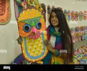 dhaka 11th apr 2022 a student poses for a photo with traditional paper works made for the bengali new year in dhaka bangladesh april 10 2022 the bangla new year is usually celebrated amid festivities every year on april 14 credit xinhuaalamy live news 2j418n1.jpg from bangla new student