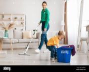 little boy helping young mother cleaning at home child getting rag out of bucket while mom mopping floor 2ja9kwc.jpg from mom rag