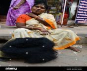a tamil woman selling cut hair cutting and shaving the head is common for pilgrims in some hindu tempes in south india in madurai tamil nadu india 2m6746w.jpg from shaving haired tamil