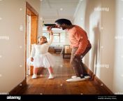 dance happy and ballet father and daughter holding hands for learning support and bonding princess teaching and music with dad and girl in black 2m7hjw7.jpg from father teaches daughter dance