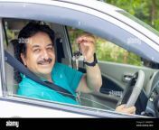 happy indian mature man sitting in car wearing seat belt show key with hand ready to drive just buy new vehicle 2m8bpph.jpg from indian driving car show