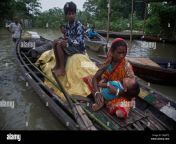 an indian flood affected woman carries her sick son on a boat in burha burhi village east of gauhati assam india monday july 15 2019 after causing flooding and landslides in nepal three rivers are overflowing in northeastern india and submerging parts of the region affecting the lives of more than 2 million officials said monday ap photoanupam nath 2mjhftj.jpg from indian village bur