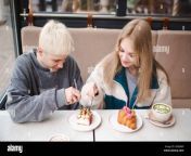 happy teenage couple girl and boy 17 18 year old having fun eating desserts in cafe together first date teenagerhood 2r8er6p.jpg from first date with 18 old cutie on the river bank ended with blowjob and cum in mouth