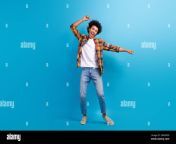 full length photo of cheerful lucky guy dressed checkered shirt having fun dancing empty space isolated blue color background 2rxmp99.jpg from lucky guy having fun with