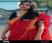 beautiful bengali lady is standing on a rooftop wearing a red saree m728wh.jpg from bangladase aunty saree