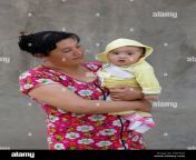 tashkent uzbekistan may 08 2017 uzbek woman stands holding her child in hand pnxtg0.jpg from uzbek send