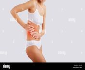 a woman holds on to the side on the body pain in the side kidn pr8n6j.jpg from kidn