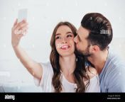boyfriend kissing girlfriend while taking selfie in bedroom rdcdc8.jpg from selfie for bf