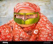a bandari woman wearing a traditional mask called the burqa at salakh qeshm island hormozgan province of iran r083p7.jpg from salakh