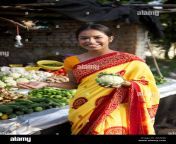 indian young woman buying vegetables at a stall w5adjx.jpg from indian aunty get vigtetable in