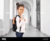 side view of pretty little african school girl walking in school on break smiling at camera cute and happy girl wearing in white blouse and jeans holding big bag pack concept of school w5j9a9.jpg from bangladesh bhola xxx school girl 14ाँव