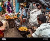 kolkata west bengal india august 112019 road side hawkers cooking and selling aloor chop and beguni bengalies famous snaks w9r6t3.jpg from bengali kolkata b