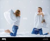 naughty twins girl and boy friendly fighting staged a pillow fight on the bed in the bedroom they like that kind of game wapfp5.jpg from www sitar and brather wap se