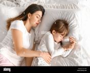 mother and her little daughter sleeping in bed w17f8p.jpg from sleeping little daughter