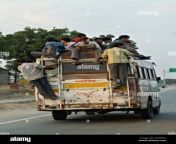 a mini bus overloaded and passengervare sitting on top of roof acgw7x.jpg from bus overload xxx video