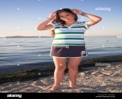 15 year old girl at beach looking into camera at beach a2dgj4.jpg from 15 gir