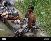 woman bathing in the rural countryside of sri lanka a2hgx3.jpg from indian village outdoor bath