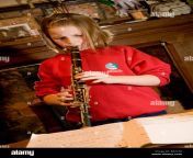 a young 10 year old primary school girl practising clarinet at home b62y38.jpg from 10 school gir