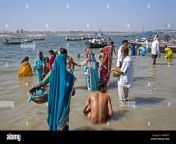 pilgrims bathing in the confluence of the ganges and yamuna rivers bhmf9y.jpg from allahabad desi