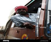 a lorry driver hangs out of his truck outside of bangalore india b34xf5.jpg from lorry drive