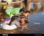 mothers washing their babies tungabhadra river hampi india c4g0pa.jpg from desi village little bathing