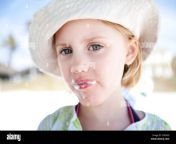 little girl with ice cream around her mouth cxr2gg.jpg from little with cream